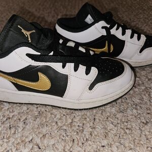 Kids Black and Gold Nike Shoes